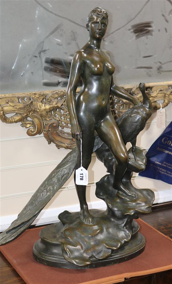 Alexander Falguiere. A bronze group of a nude woman standing beside a peacock, 29.5in.
